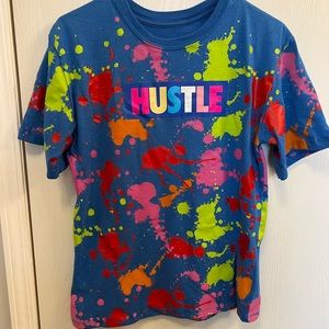 Hustle, paint splatter, tee shirt, blue.